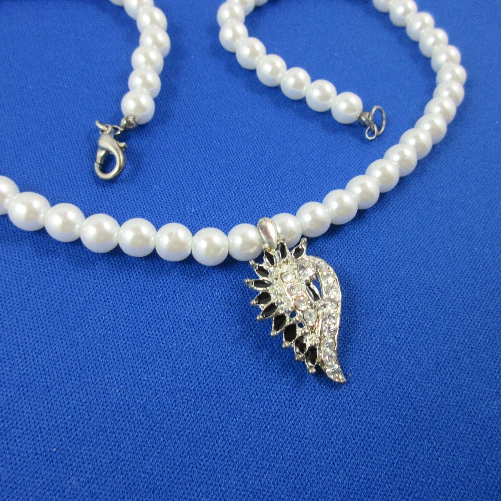 Rhinestone, clear and black pendant and pearls